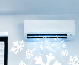 an air conditioning unit installed on a wall with a cold air graphic