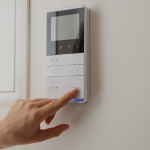 a person using a controller to change the settings on their air conditioning unit