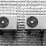 Two commercial air conditioning units installed next to each other