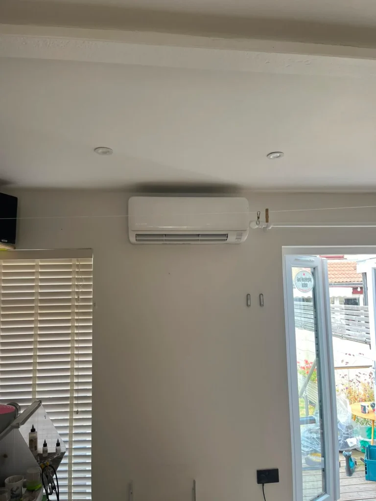Wall-mounted air conditioning unit installed in a living room