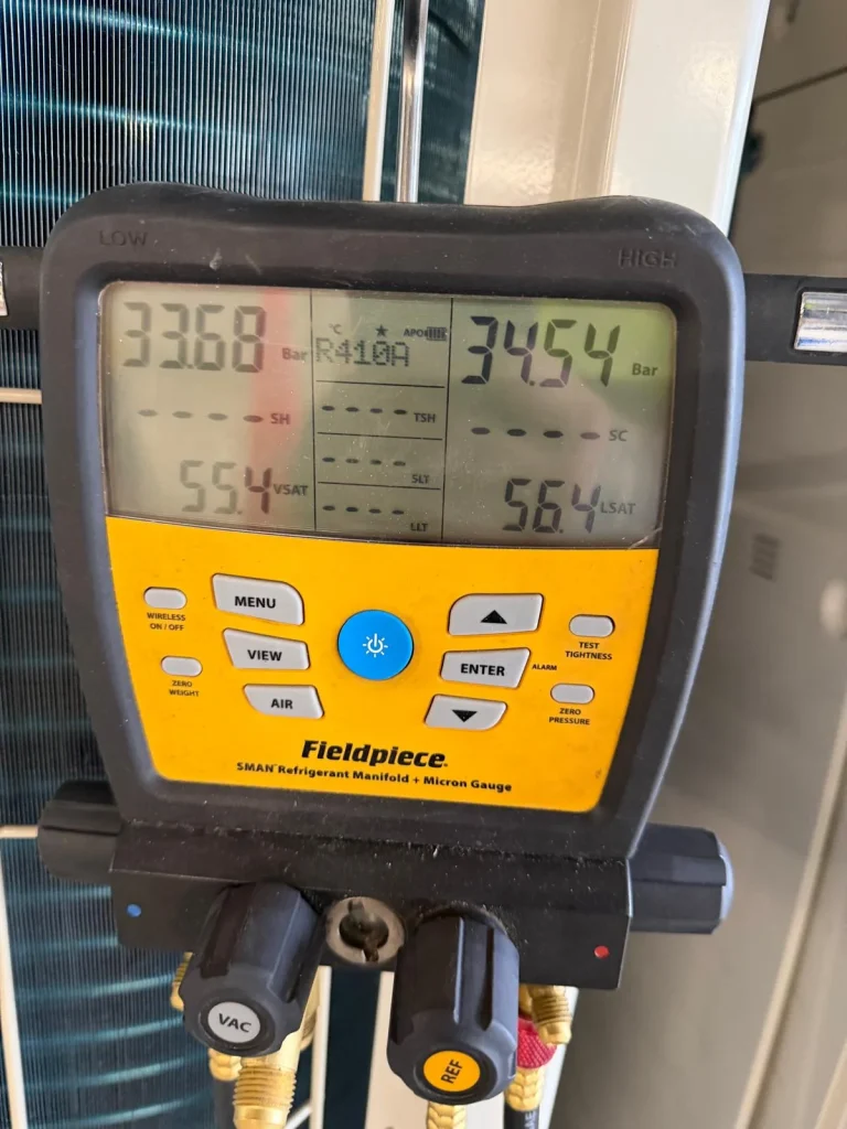Engineer gauge showing refrigerant pressures during an air conditioning service